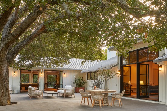 An old Oak tree is now a focal point of the building, centered in the back patio.