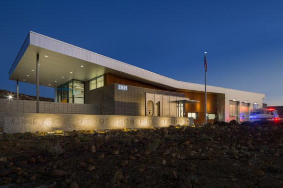 Exterior materials consist of a combination of filled and polished or ground faced stacked concrete masonry units emerged from the existing native volcanic rock palette. 