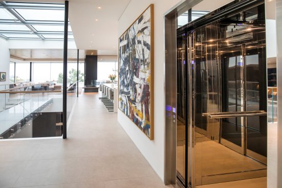 Luxury elevator in modern open plan Beverly Hills home.