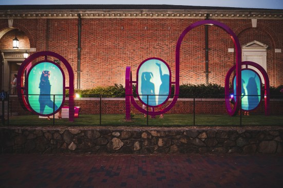 A group stops and strikes a pose in pARC's shadow play panels. 
