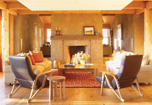 The durable zinc roof satisfies the local requirement for a nonreflective material, and thick pise walls, ceiling fans, and operable windows supply natural air conditioning.