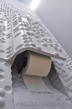 Panels were formed to accommodate an accessory console that holds everything from toilet paper to a cell phone as well as the designers' signature.
