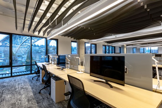 The open office has views of the adjacent Aurora Bridge. 