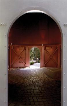 The architects reused the second grain silo as a courtyard entry and used steel and aluminum window openings in context with the vintage character of the original building.