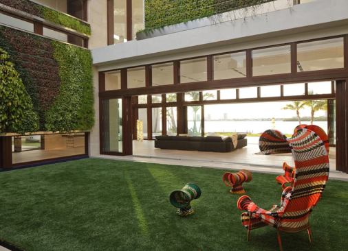 In addition to the private courtyards, the home features three “green walls” covered with over 17,000 tropical salt-tolerant plants.