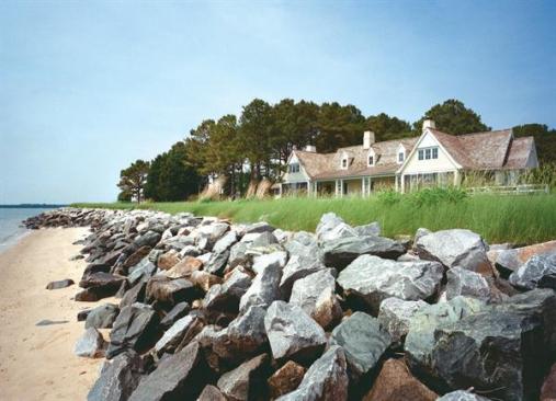 The home's traditional detailing, such as the dovecote on the front gable, above, stems from the regional architecture of Maryland's Eastern Shore.