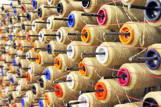 In the Ray C. Anderson Plant in West Point, Ga., Interface’s patented system of portable creels releases yarn from cones at the precise tension needed to tuft the carpet.