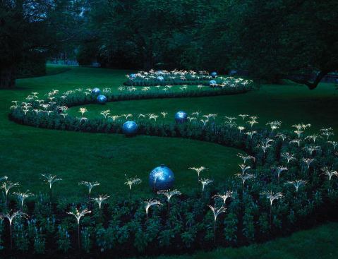 For Arrow Spring, located just past the formal flower gardens to the south of the Peirce-du Pont house, Munro has created a 300-foot-long serpentine trail of four different types of sage plants. Designed to recall the form of a flowing river stream by day, at night it transforms into a shimmery thread of greenery. Munro takes advantage of the sage's silvery-blue quality and highlights it using 16 LED flashlights, staked in the ground, along with bare optic fiber that is weaved and hidden among the plants to create the luminescent glow.