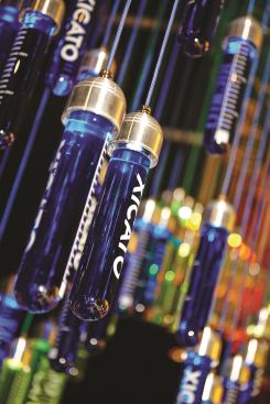 A detail of the water-filled colored test tube installation designed by U.K.-based Light Collective for Xicato’s tent.