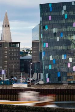 View of northeast corner of building with city of Reykjavik beyond.