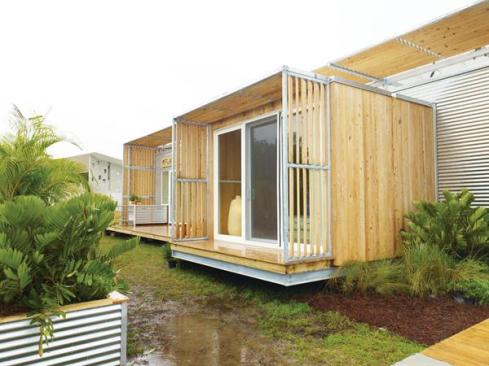Students designed FLeX House in a simple rectangular form and used inexpensive finish materials like corrugated metal and wood siding.