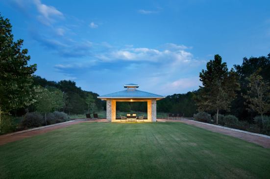 In the evening, the glowing pavilion beckons.