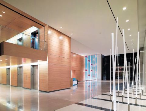 The elevator core, illuminated by fluorescent covelighting, is located about 200 feet from the lobby entrance.