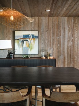 In the Dining Space Custom Cypress Wood Panels Clad the Wall and Ceiling