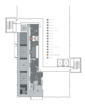 Floor plan. The bath is part of a loft designed as one large, linear volume. Service spaces next to the building’s core, such as the bath, have large openings into the areas they serve.