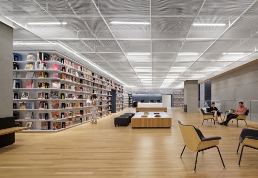 Downstairs, an expanded metal mesh ceiling shields T5 fluorescent lighting, which was selected for energy code and budgetary reasons.