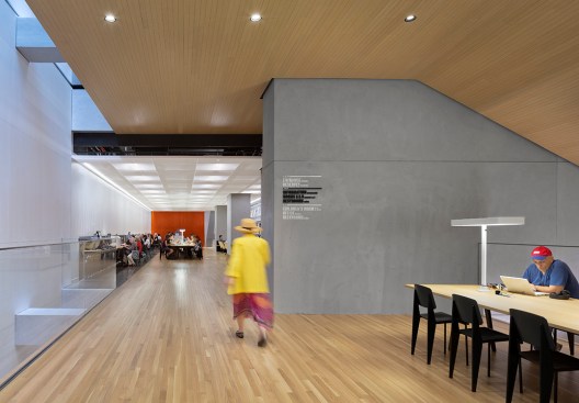 Reading tables feature personal tasklighting and daylighting is introduced to the lower levels of the library from skylights along the back wall.