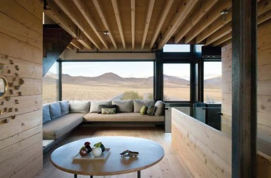 Large windows offer expansive views of rugged central Idaho in all directions from this home’s open floorplan. The window seat is designed as a spot to take in the scenery—or a nap.  Residential Architect, March-April 2009  
Outpost, central Idaho  Olson Kundig Architects, Seattle