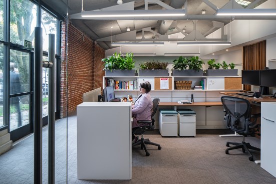 Staff areas include a small conference room, open offices, private offices and quick access to the public spaces on the front side of the building.