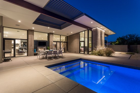 Pool is centered on the main fireplace element of the home.  The fireplace is 2 sided and is engineered 
to allow for open glass above fire place which frames the mountain beyond. 