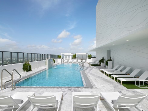 The 50th floor amenity deck includes one of the highest rooftop resort style pools in Miami