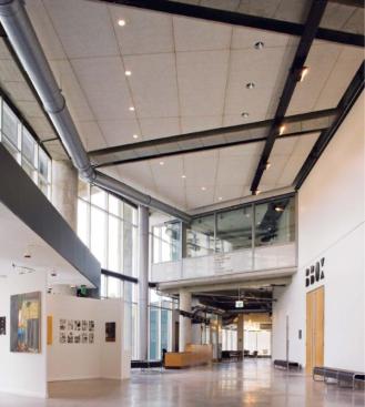 The lobby doubles as a gallery, with partitions that can be brought in to showcase student work. These informal art shows get a boost in attendance from people arriving for performances in the BBox theater, a black box theater for movie screenings, lectures, concerts, and other events.