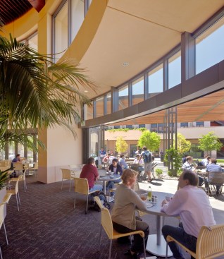 The dining room's glass walls fold back accordion-style to allow diners to engage with the outdoor activities