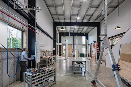 Pre-fabricated steel structural bays, erected over the course of a few days, were customized with squared-off edges, in lieu of the typical tapered edges.