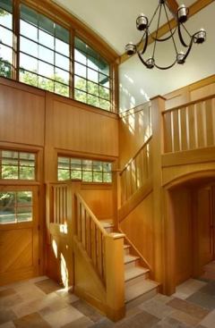 The fir-paneled entry hall of the Arts and Crafts House