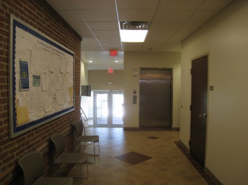New Accessible Elevator Addition Entrance to Provide Access to Seperate Buildings (Note the Original Exterior Brick)