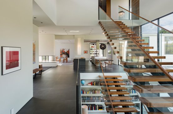 Walker Road modern home interior with floating staircases in the open central volume