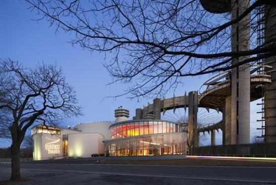 Theater illuminated at dusk.