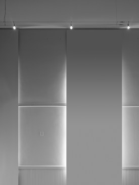 The+free+hanging+blackout+shades+cover+the+windows+and+protect+the+art+from+harmful+UV+rays.