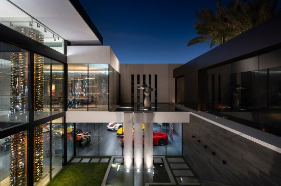 Serenity Indian Wells modern architectural mansion glass wall luxury car garage & courtyard waterfall