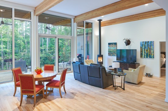 The 13-foot-high ceiling and glazing connect the interior to the exterior.