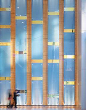 The dichroic glass wall is the main feature of the lobby space, created from the idea of an "artificial waterfall."