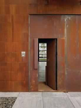 The lower handle opens a standard-size entry door.