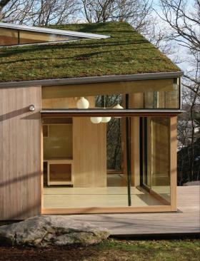 On approach, the sod roof tips up, preserving the buildings scale while allowing for head clearances upstairs. 