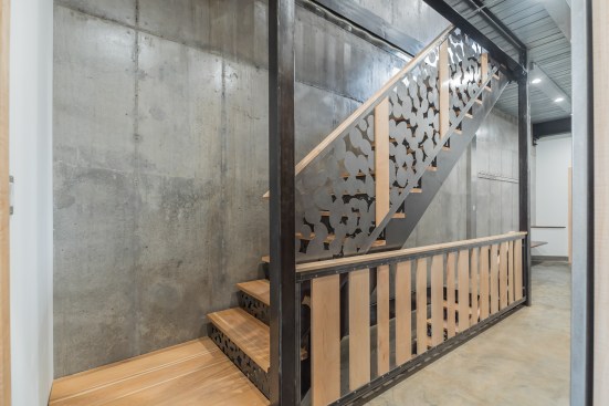 Pebble design laser cut steel stairs with PA hickory treads & PA curly maple balustrade, handrails