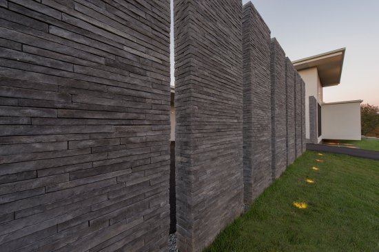 Walker Road modern home textured outdoor stacked stone wall