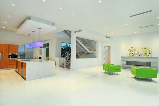 Outdoor living space over-looking New Pass. Teak stained cypress ceilings ties into the Kitchen cabinets and stair treads.