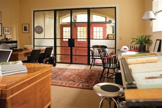 In a previous life, the first floor of this carriage house served as a stable and workshop for lobster-trap makers. Now the space is an 
artful home office for architect Carol De Tine that makes the most of its historic charm with salvaged wood and stone, and adds modern elements with a steel and glass doorway. Project: Carriage House Studio, Portland, Maine; Architect: Carol De Tine, Portland