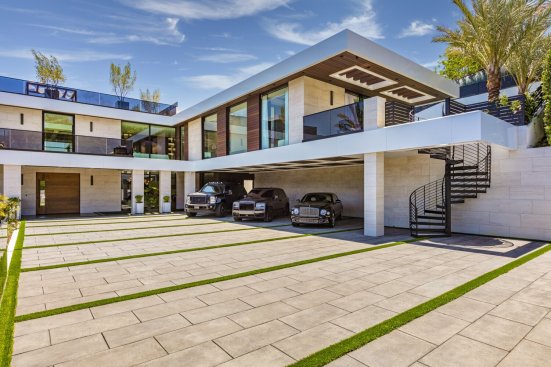 Luxury modern Los Angeles home entrance driveway and covered parking area.
