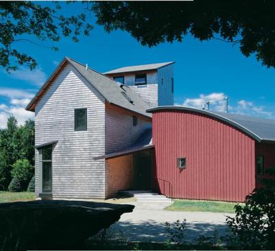 Three traditional building forms a gable-roofed main house, a shedlike studio, and a saltbox-style loft come together in an unexpected fashion.