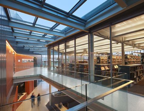 A view of the main corridor with reading and stack areas to the right.
