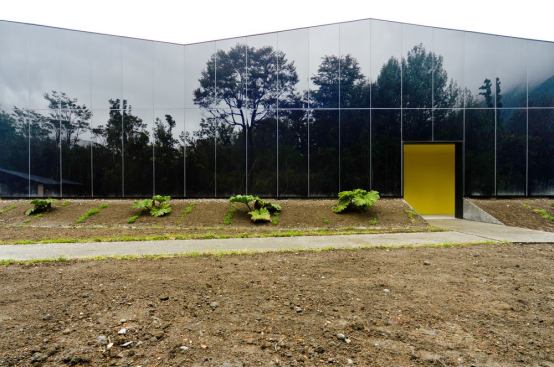 Another look at the façade, with its glazing reflecting the surrounding landscape.