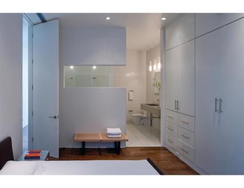 A full-height door opens to the master bedroom and adjoining bath