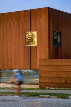Minimal trim and flush windows amplify the planar aspect of the elevations and overall form. Exterior detailing includes steel panel transition joints carefully choreographed to align with window centers and concrete foundation control joints.