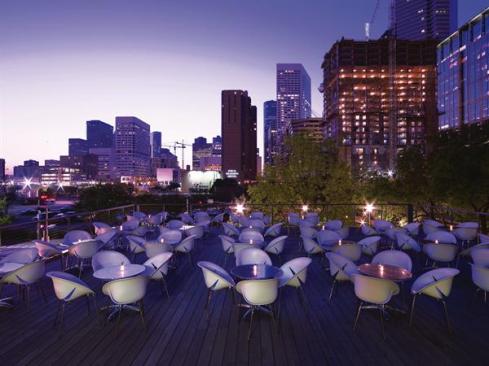 On the second-floor deck, patrons have a view of the Houston skyline?a reminder that despite the bucolic setting of the ground floor, the restaurant is in the heart of downtown. Plastic chairs and metal tables can withstand the region?s summer thunderstorms, and the view of Discovery Green is maintained by a minimal custom handrail that features stainless steel wire cables threaded through painted steel pipe.