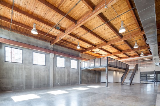 The ground floor features a flexible space for events. A space with a loading dock, for example, features handrails that can be removed to create a stage area.